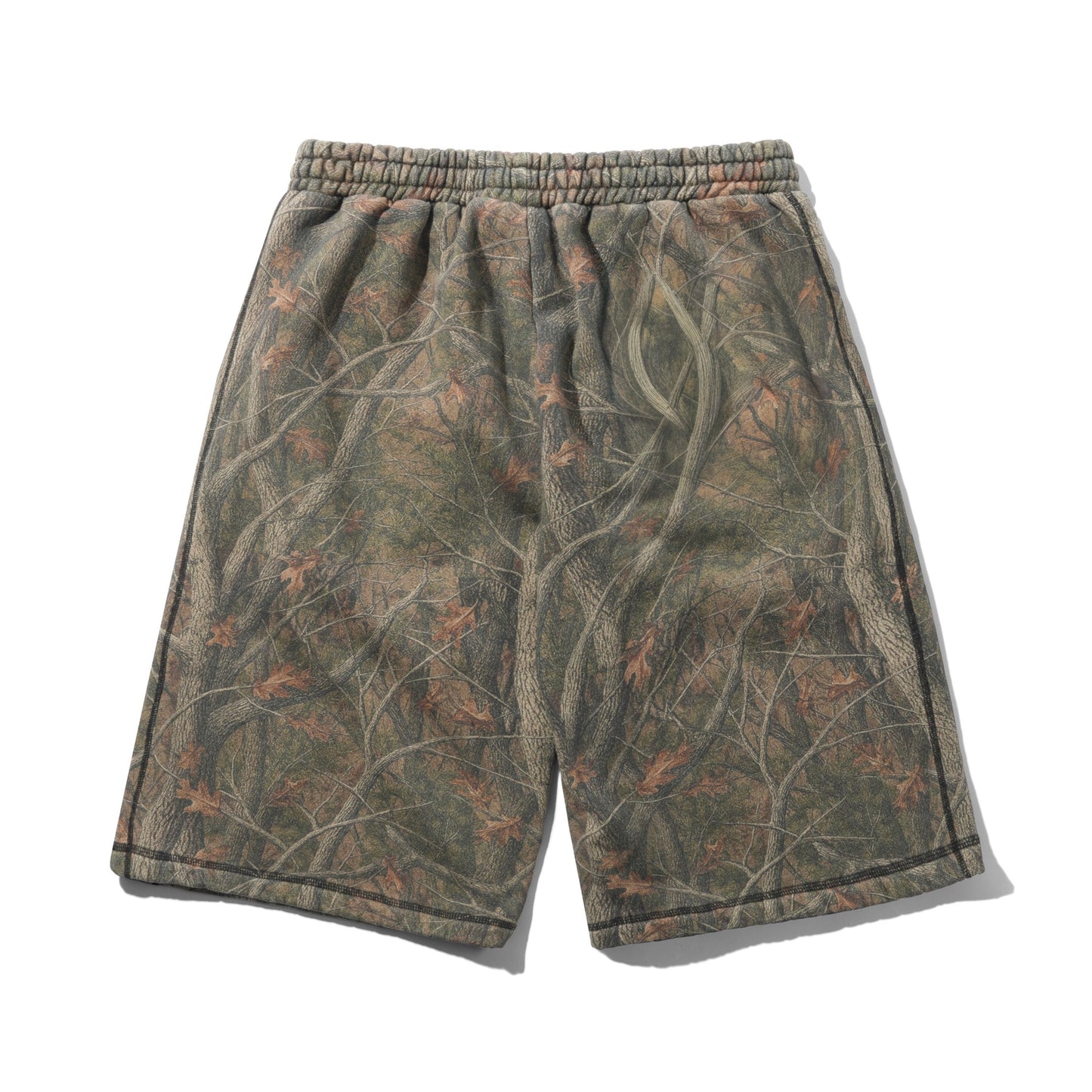 A pair of athletic shorts featuring an all-over woodland camouflage pattern with branches and leaves in shades of brown, green, and gray, complete with an elastic waistband.