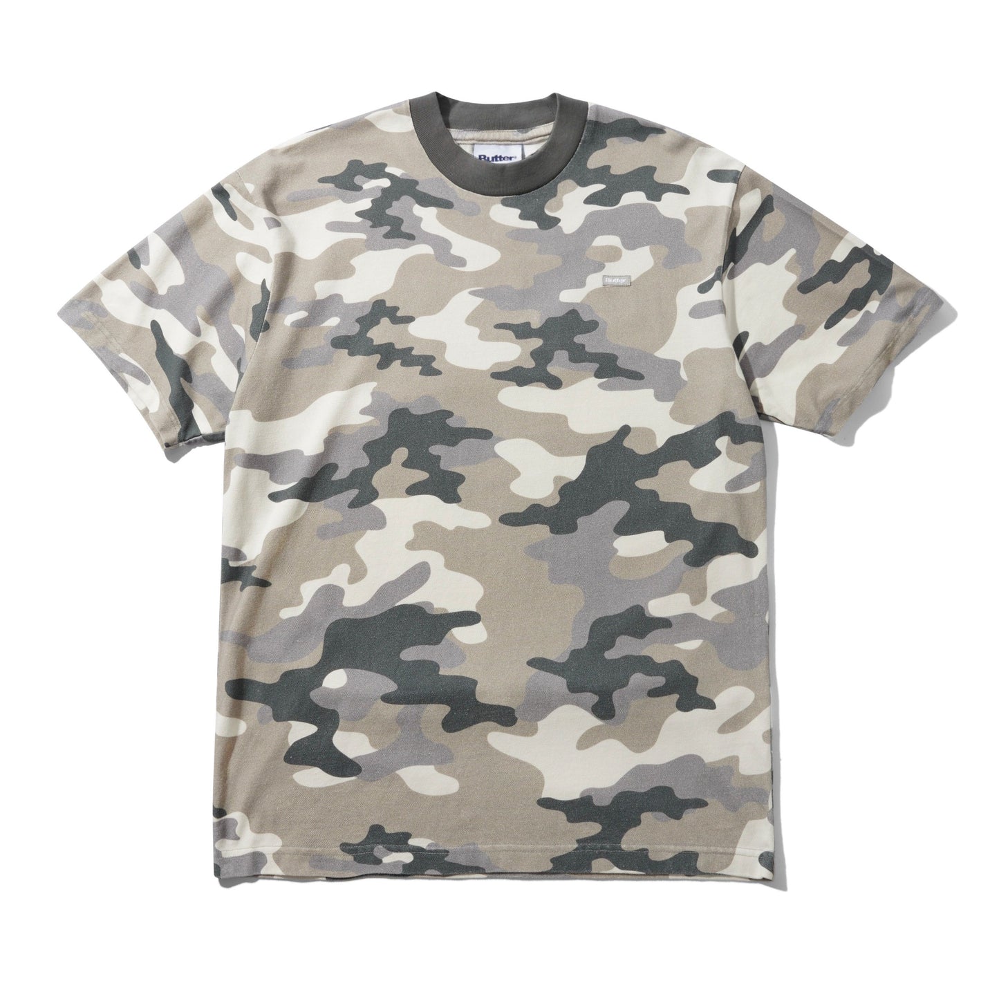 A short-sleeve crewneck t-shirt featuring a classic camouflage pattern in shades of beige, gray, and dark charcoal, laid flat against a white background.
