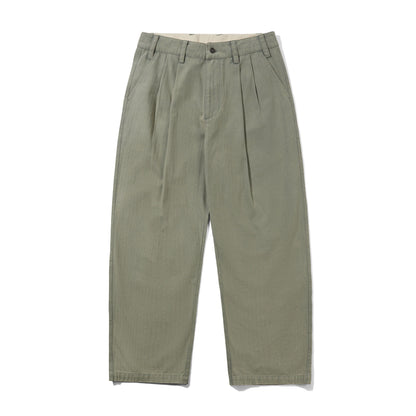 A pair of olive green pleated trousers laid flat against a white background.