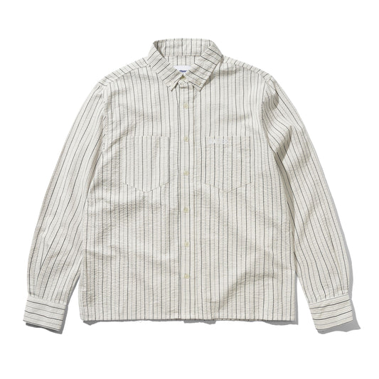 A long-sleeve button-down shirt with a textured, slightly wavy fabric, featuring vertical thin stripes in dark brown and beige on an off-white base. It has a classic collar, button-down front, and two chest pockets.