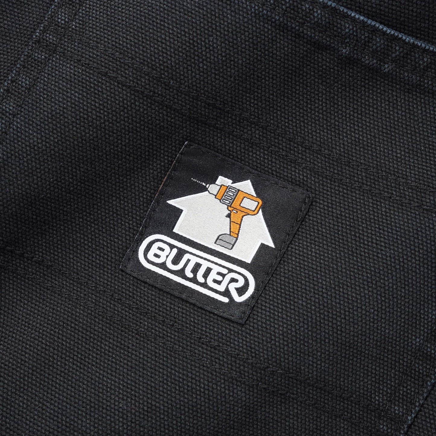 Butter Goods logo patch on black pants