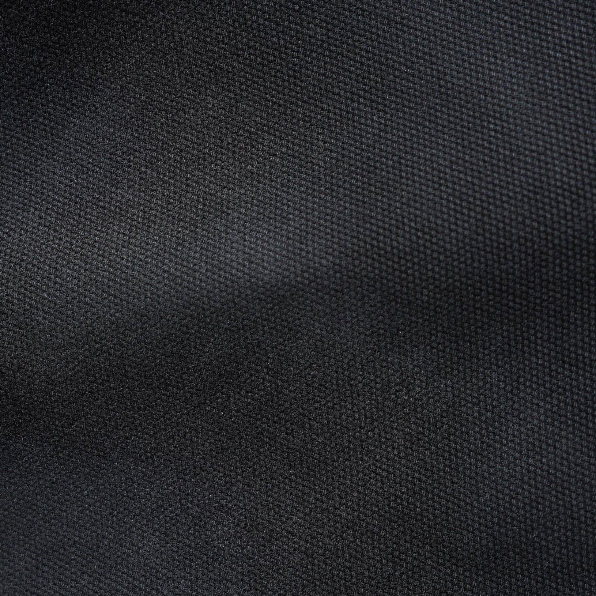 A close-up of dark charcoal gray woven fabric texture with soft folds and a fine ribbed pattern.